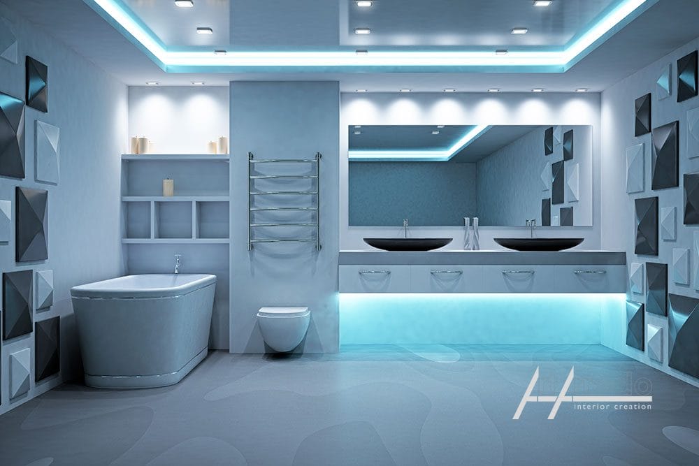 Interno del bagno moderno con vasca freestanding, doppi lavandini, WC e illuminazione a LED blu di ArtArredo Piacenza.